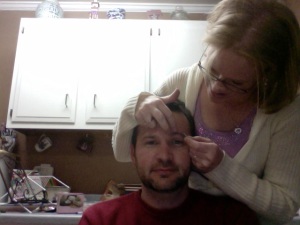 My wife plucking my eyebrow